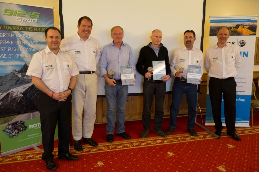 Mark Paskevich, second from right, accepts award on behalf of Rotech Research.