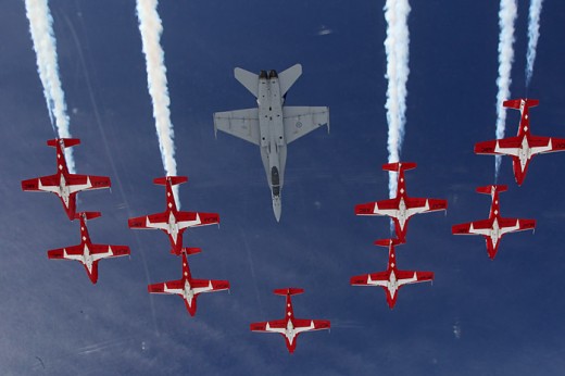The CF-18 tucks into the slot with the Snowbirds during Spring Training in Comox.